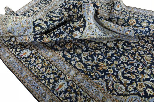 Surface texture of 2000s Kashan rug with natural Wool and intricate pattern