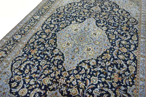 Backside of handmade 2000s Kashan rug showing knot structure and weave density