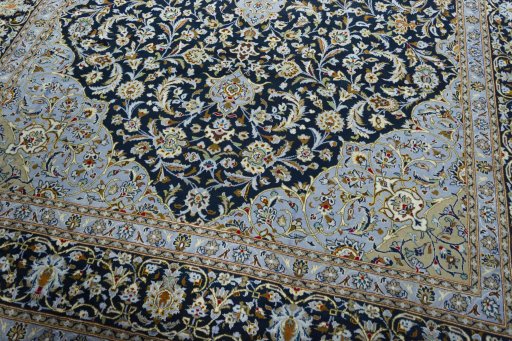 Close-up detail of 2000s Kashan rug from Iran / Persia showing Wool weave