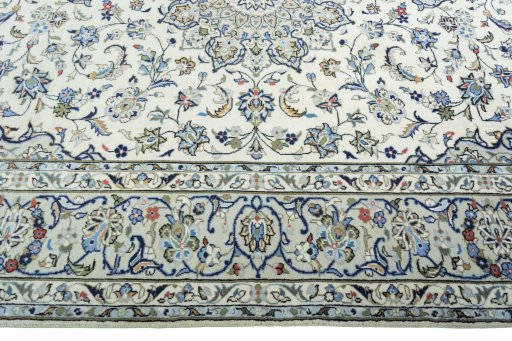 Corner detail of New Kashan rug showing border pattern and Wool pile