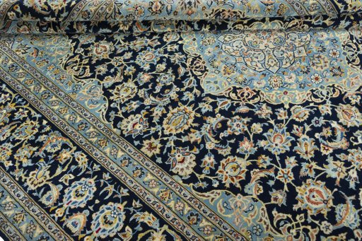 Close-up detail of 2000s Kashan rug from Iran / Persia showing Wool weave