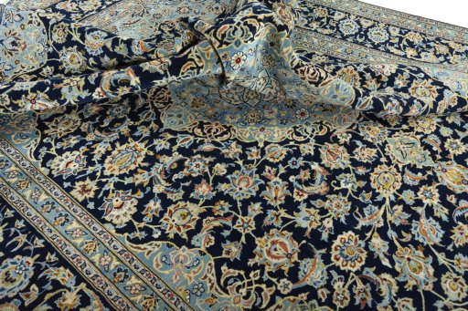 Surface texture of 2000s Kashan rug with natural Wool and intricate pattern