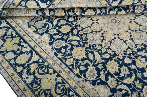 Close-up detail of 2000s Kashan rug from Iran / Persia showing Wool weave