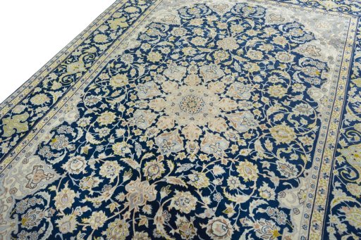 Backside of handmade 2000s Kashan rug showing knot structure and weave density