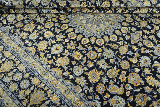 Close-up detail of 2000s Kashan rug from Iran / Persia showing Wool weave