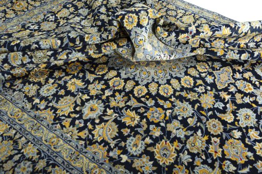 Surface texture of 2000s Kashan rug with natural Wool and intricate pattern