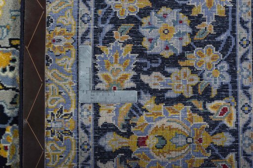 Backside of handmade 2000s Kashan rug showing knot structure and weave density