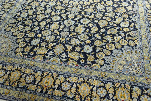 Close-up detail of 2000s Kashan rug from Iran / Persia showing Wool weave