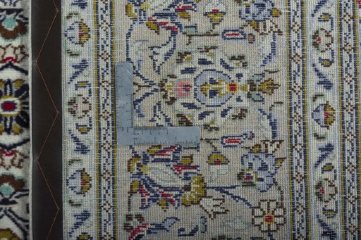Backside of handmade 2000s Kashan rug showing knot structure and weave density