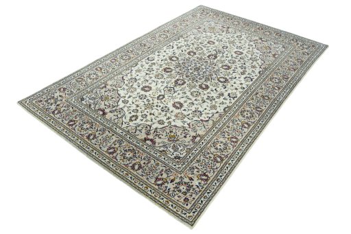 Corner detail of 2000s Kashan rug showing border pattern and Wool pile
