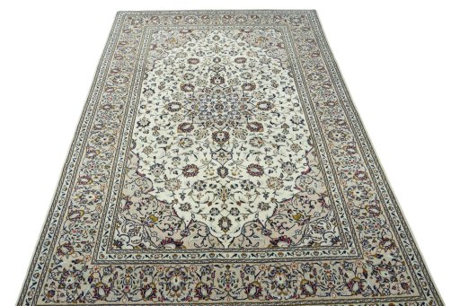 Surface texture of 2000s Kashan rug with natural Wool and intricate pattern