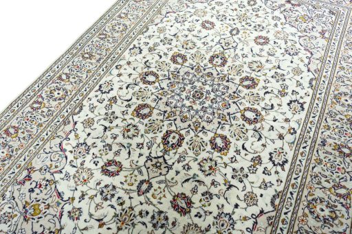 Backside of handmade 2000s Kashan rug showing knot structure and weave density