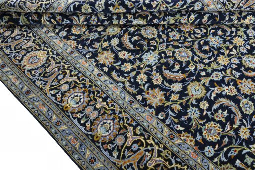 Close-up detail of 2000s Kashan rug from Iran / Persia showing Wool weave