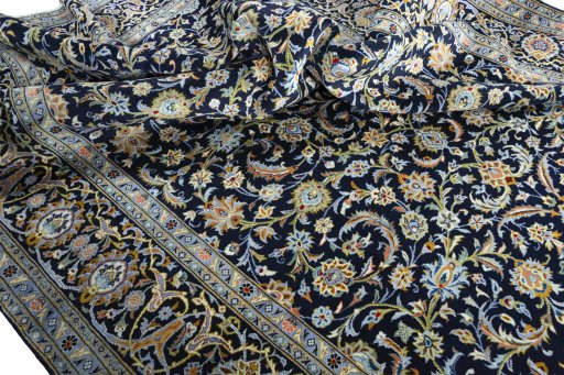 Surface texture of 2000s Kashan rug with natural Wool and intricate pattern