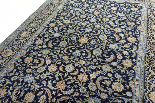 Backside of handmade 2000s Kashan rug showing knot structure and weave density