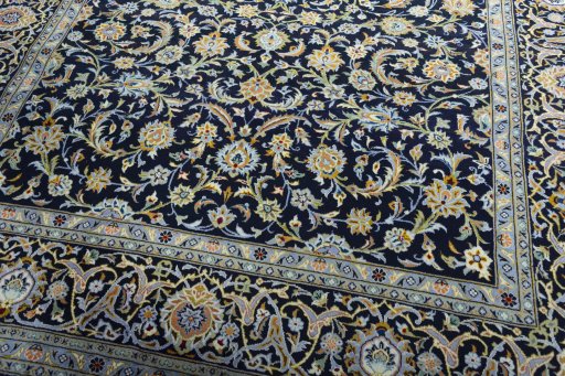 Close-up detail of 2000s Kashan rug from Iran / Persia showing Wool weave