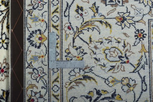 Backside of handmade New Kashan rug showing knot structure and weave density