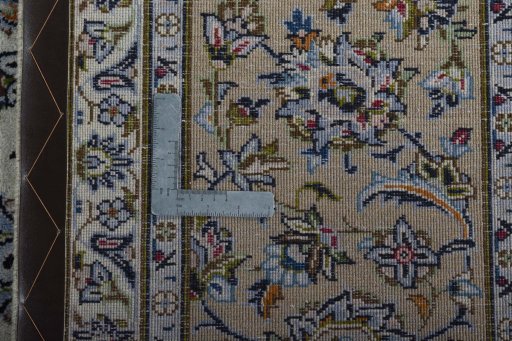 Backside of handmade 2000s Kashan rug showing knot structure and weave density