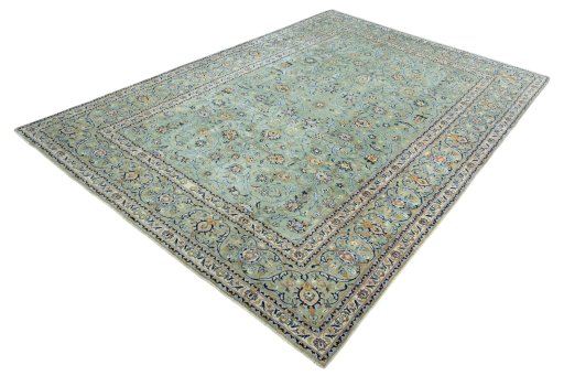 Corner detail of 2000s Kashan rug showing border pattern and Wool pile