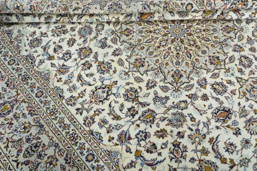 Close-up detail of 2000s Kashan rug from Iran / Persia showing Wool weave