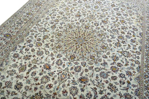 Backside of handmade 2000s Kashan rug showing knot structure and weave density
