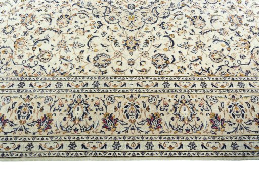 Corner detail of 2000s Kashan rug showing border pattern and Wool pile