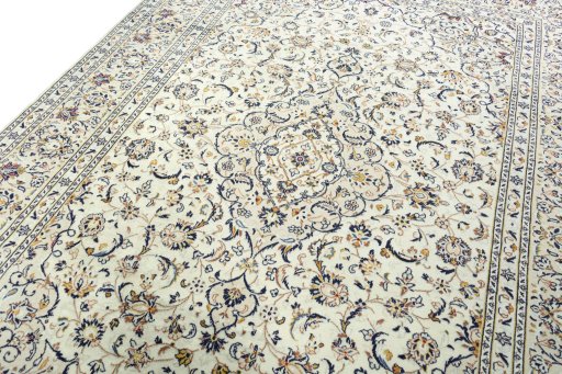 Backside of handmade 2000s Kashan rug showing knot structure and weave density