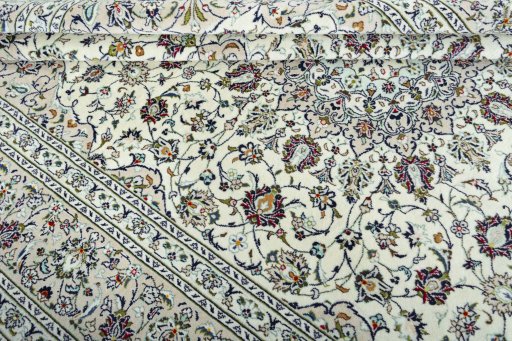 Close-up detail of 2000s Kashan rug from Iran / Persia showing Wool weave