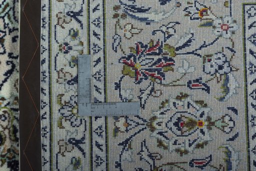 Backside of handmade 2000s Kashan rug showing knot structure and weave density