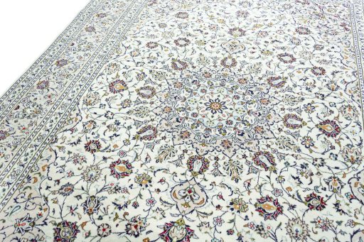 Backside of handmade 2000s Kashan rug showing knot structure and weave density