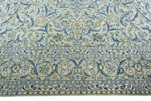 Corner detail of 2000s Kashan rug showing border pattern and Wool pile