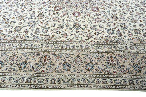 Corner detail of 2000s Kashan rug showing border pattern and Wool pile