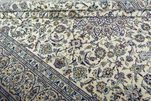 Close-up detail of 2000s Kashan rug from Iran / Persia showing Wool weave