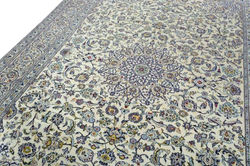 Backside of handmade 2000s Kashan rug showing knot structure and weave density