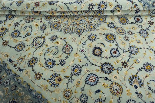 Close-up detail of 2000s Kashan rug from Iran / Persia showing Wool weave