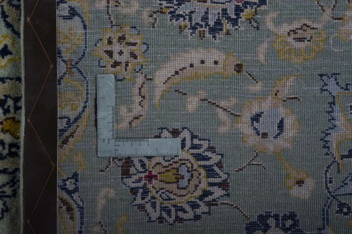Backside of handmade 2000s Kashan rug showing knot structure and weave density