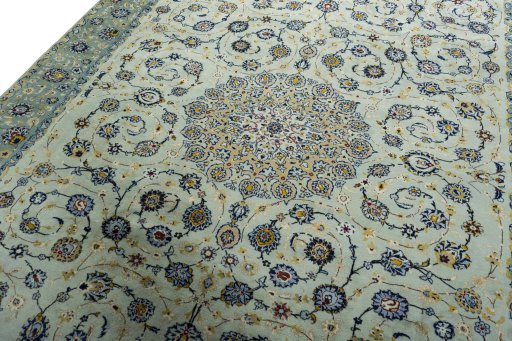 Backside of handmade 2000s Kashan rug showing knot structure and weave density