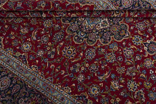 Close-up detail of 2000s Kashan rug from Iran / Persia showing Wool weave