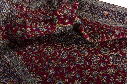 Surface texture of 2000s Kashan rug with natural Wool and intricate pattern