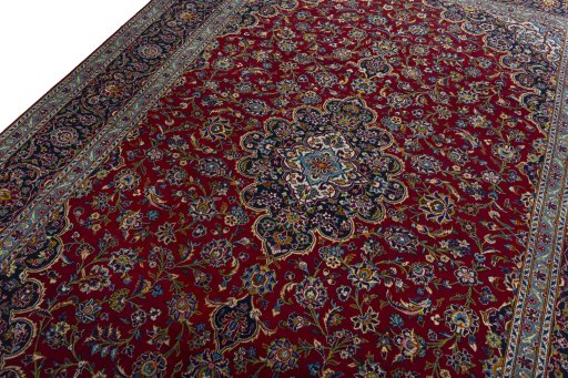 Backside of handmade 2000s Kashan rug showing knot structure and weave density