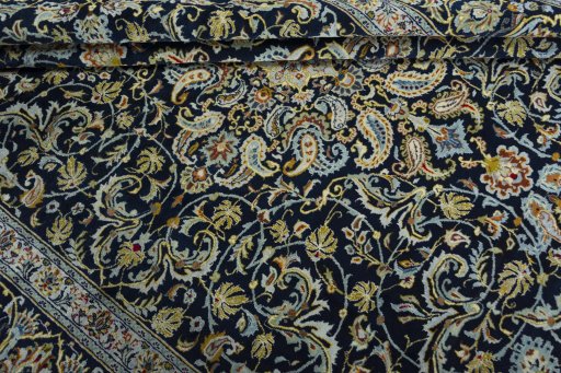 Close-up detail of 2000s Kashan rug from Iran / Persia showing Wool weave