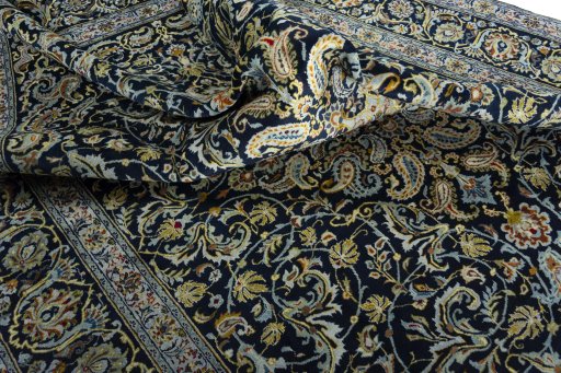 Surface texture of 2000s Kashan rug with natural Wool and intricate pattern