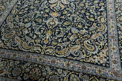 Close-up detail of 2000s Kashan rug from Iran / Persia showing Wool weave