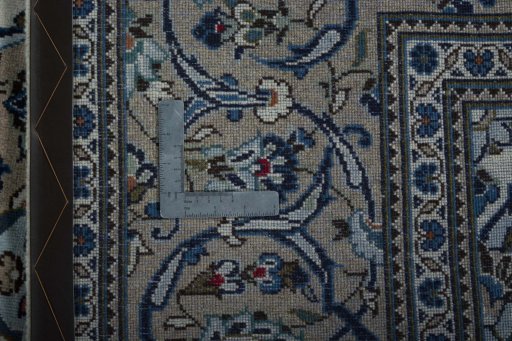 Backside of handmade 2000s Kashan rug showing knot structure and weave density