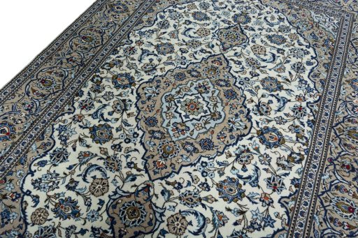 Backside of handmade 2000s Kashan rug showing knot structure and weave density
