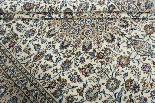 Close-up detail of 2000s Kashan rug from Iran / Persia showing Wool weave