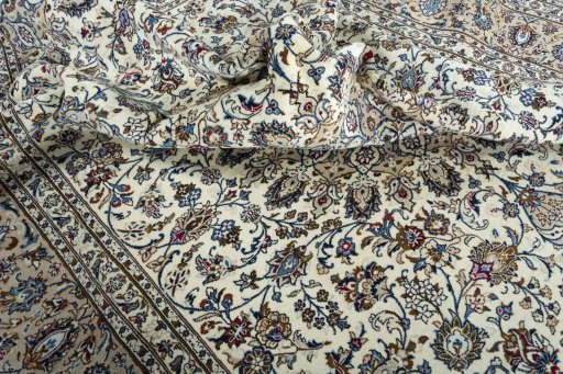 Surface texture of 2000s Kashan rug with natural Wool and intricate pattern