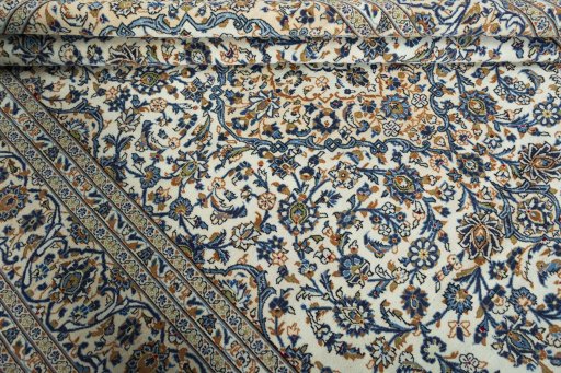 Close-up detail of 2000s Kashan rug from Iran / Persia showing Wool weave