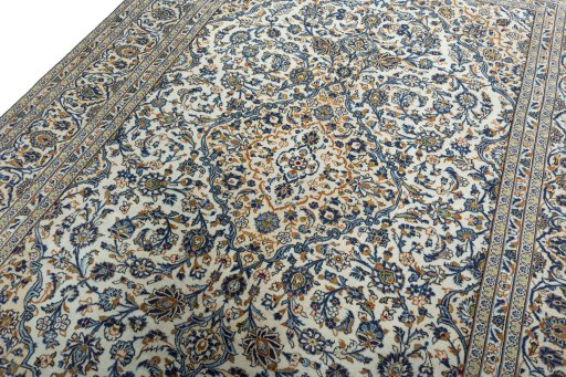 Backside of handmade 2000s Kashan rug showing knot structure and weave density