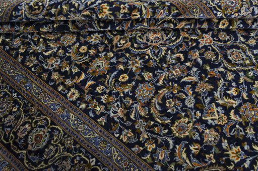Close-up detail of 2000s Kashan rug from Iran / Persia showing Wool weave